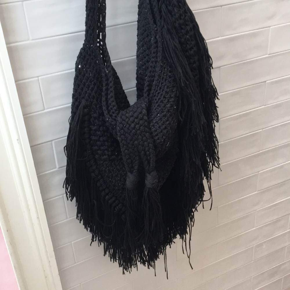 Indah Black fringe knit handbag. Revolve